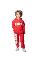 Kids RAWYALTY KIDS RAW sweatpants in red, comfortable and stylish, featuring an elastic waistband and soft fabric.