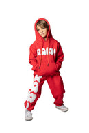 Kids RAWYALTY KIDS RAW sweatpants in red, featuring comfortable fabric and casual fit, perfect for active kids.