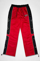 Men's red First Row State of Mind Cross track pants with a relaxed fit and athletic design, featuring side pockets and branding details.