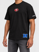 Black Pro Standard San Francisco 49ers Wingspan T-shirt with drop shoulder design and team logo on front.
