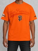 Orange Pro Standard San Francisco Giants Living Large drop shoulder T-shirt with team logo and bold graphic design.