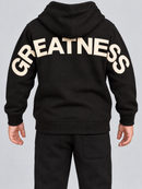 Kids Jordan Craig ‘Greatness’ Wingspan Hoodie in Oreo, featuring a black hoodie with white wingspan design and front pocket.