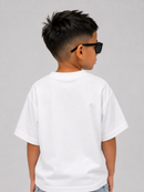 A child model shown from the back wearing a plain white short-sleeve t-shirt and black sunglasses, set against a solid light gray background.