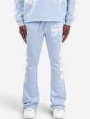 Copper Rivet Saint Patched Stacked Sweats In Light Blue