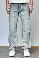Person wearing light blue rhinestone distressed jeans and white sneakers against a plain background. By Fresh N Fitted.