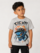 A young boy wearing a heather gray t-shirt with a large graphic of a blue demon skull and the word 'SIGMAI' printed on the front, paired with black cargo pants, against a light gray background.