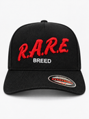 Black and red MUKA Rare Breed corduroy snapback hat with adjustable strap and embroidered logo.