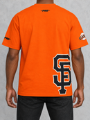 Orange Pro Standard San Francisco Giants Living Large drop shoulder t-shirt with team logo and bold design.