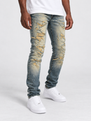 Jordan Craig Sean 'Alkaline' fit denim jeans with shredded details in desert color, showcasing distressed denim style.