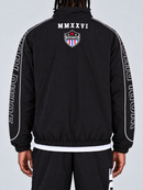 Men's black Copper Rivet 'World Wide' windbreaker jacket with zip-up front and rivet details, shown from the back.