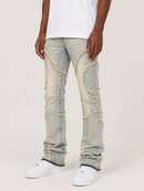 A person wearing light-wash distressed denim jeans with decorative frayed thread detailing and white sneakers, shown from the waist down against a plain light background.