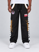 Men's black Copper Rivet windbreaker sweatpants with rivet details and nylon fabric, designed for casual comfort and style.