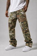 A person wearing camouflage cargo pants with a white t-shirt and white sneakers, shown from the waist down against a light gray studio background.