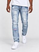 Makobi Modena denim jeans in light wash, slim fit style, displayed on a hanger showing front view and classic five-pocket design.