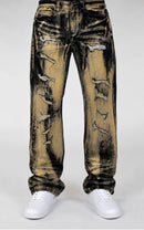 Distressed brown wash jeans in a brown and tan colorway, shown on a model from the waist down wearing white sneakers against a light gray background. By Fresh N Fitted.