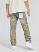 A child wearing light-wash distressed denim jeans with yellow and white thread detailing, a cream t-shirt, and white sneakers, shown from the back against a light gray studio background.