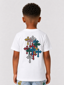 A child viewed from behind wearing a white short-sleeve T-shirt with a large multicolor cross graphic on the back, paired with light blue jeans against a light gray studio background.