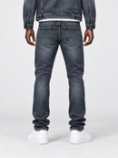 Smugglers Moon crystallized slim denim pants in washed black, showing close-up of textured black denim fabric.