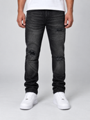 Reason distressed washed black denim jeans, slim fit style with fading and distressed details, casual streetwear look.