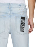 Ksubi Chitch Kstellar Effect blue denim jeans with distressed details and unique stitching, showcasing trendy denim fashion.