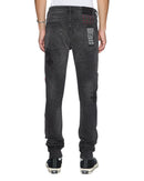 Ksubi Van Winkle Blakk Metal Paise denim jeans with distressed detailing and metal accents on a model.