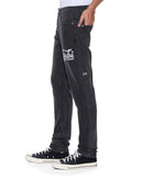 Ksubi Chitch Powder Grey Outfield denim jeans in charcoal with a slim fit and classic five-pocket design visible in the image.