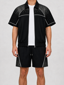 Black Kindred Rhinestone Nylon Shorts by KIND RED, featuring rhinestone details and a fitted style, shown on a model in Emeryville.