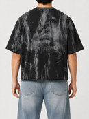 Men's black BKYS Disaster cropped rhinestone T-shirt with bold design, showcased on a model in Sacramento, California.