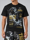 A man wearing a black graphic t-shirt with a detailed classical statue print and gold text reading 'RISE ABOVE', paired with matching black shorts featuring a similar graphic design.
