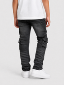 A person shown from the back wearing dark gray washed cargo jeans, a white t-shirt, and white sneakers against a light gray studio background.