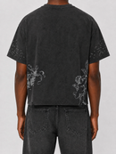 Black washed cropped T-shirt by Prestige featuring distressed angel graphic design.