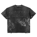 Black wash cropped T-shirt by Prestige featuring a distressed angel graphic, styled casually on a model.