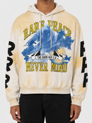 A person wearing a beige and cream tie-dye hoodie with a blue graphic print and yellow text reading 'RARE PEACE NEVER MIND' and 'THE DARK AGE 2.0'.