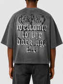 Grey oversized rhinestone T-shirt from RARE PEACE with "Trust No One" text, cropped fit and bold, eye-catching design.