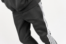 Rebel Minds Five Stripes stacked grey and white sweatpants with a relaxed fit, featuring bold stripe detailing on the legs.