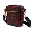 Red and black patterned crossbody bag with gold zipper and black strap on a white background