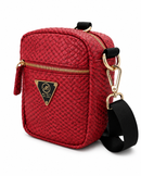 Red quilted crossbody bag with gold accents on a white background