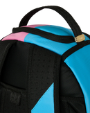 Close-up of a backpack showing black webbing straps, a bright cyan blue panel, a pink panel, and a small gold zipper pull on a white background.