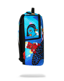 A sprayground backpack featuring a colorful cartoon print with a blue bird, a red bear, and geometric patterns on a white background.
