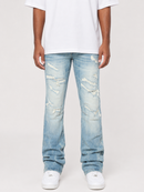 Light wash blue distressed jeans with ripped details on the thighs and knees, shown on a model wearing a white t-shirt and white sneakers against a light gray background.