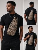 Man wearing a black t-shirt with a snake skin patterned bag on a gray background