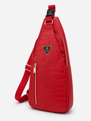 Red sling bag with a gold zipper on a white background
